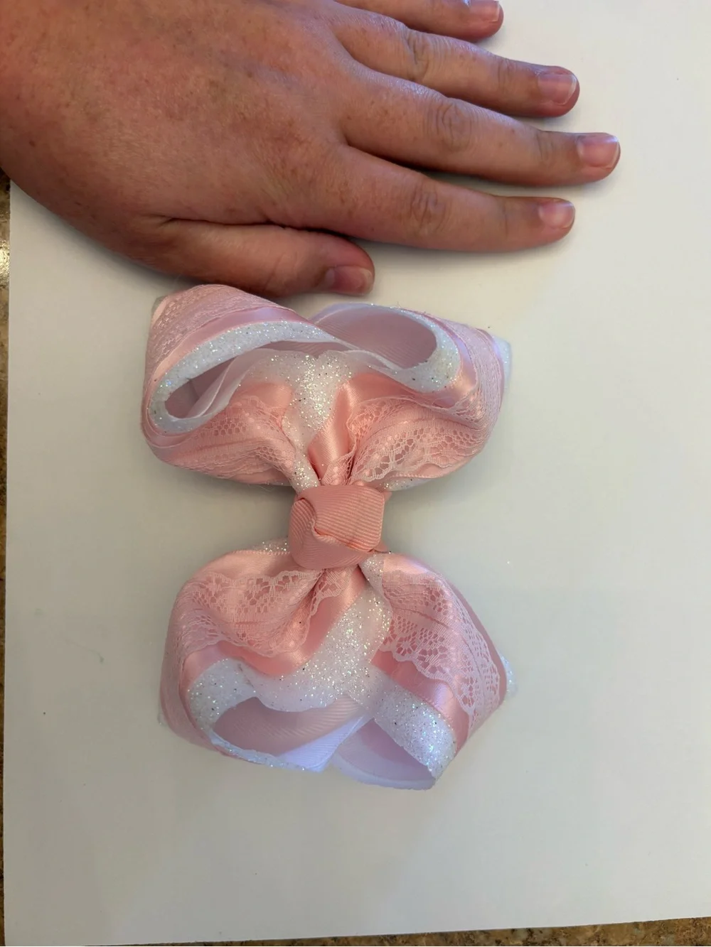 Lynlee Blair's Pink and white glitter bow